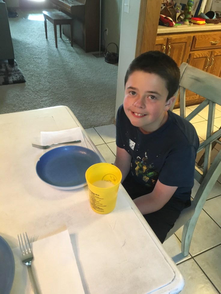 Kids' cup too close to edge of dinner table