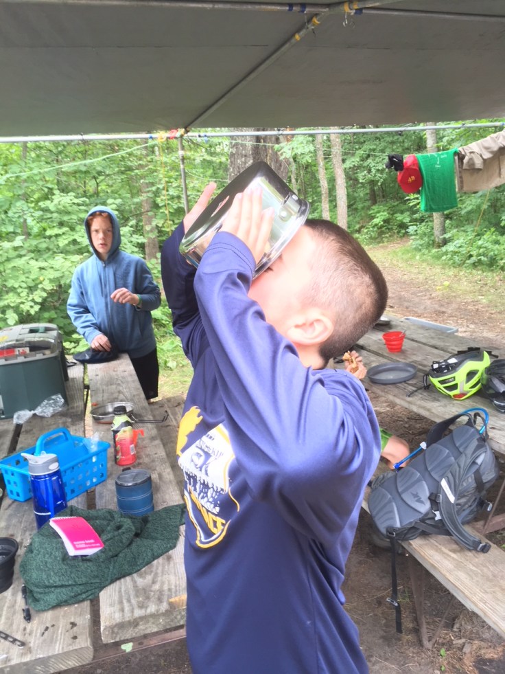 drinking from camp mess kit