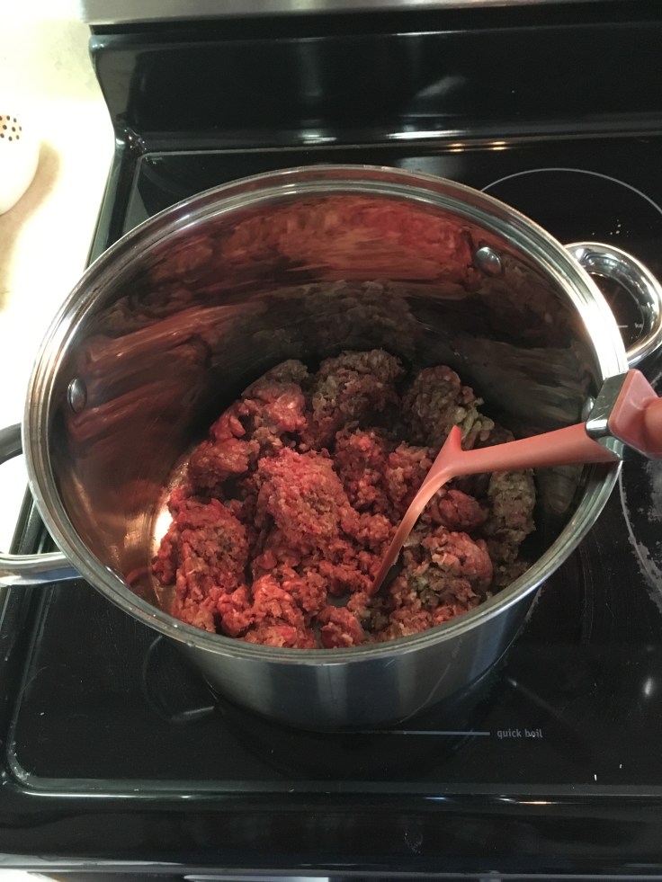 Browning ground beef in stew pot